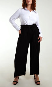 CURVE WIDE LEG PLEATED TROUSERS