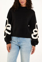 Load image into Gallery viewer, BLACK FRILLED FLOWER SLEEVE HIGH NECK JUMPER